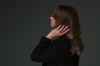 Photo of Attractive woman with stylish haircut on grey background