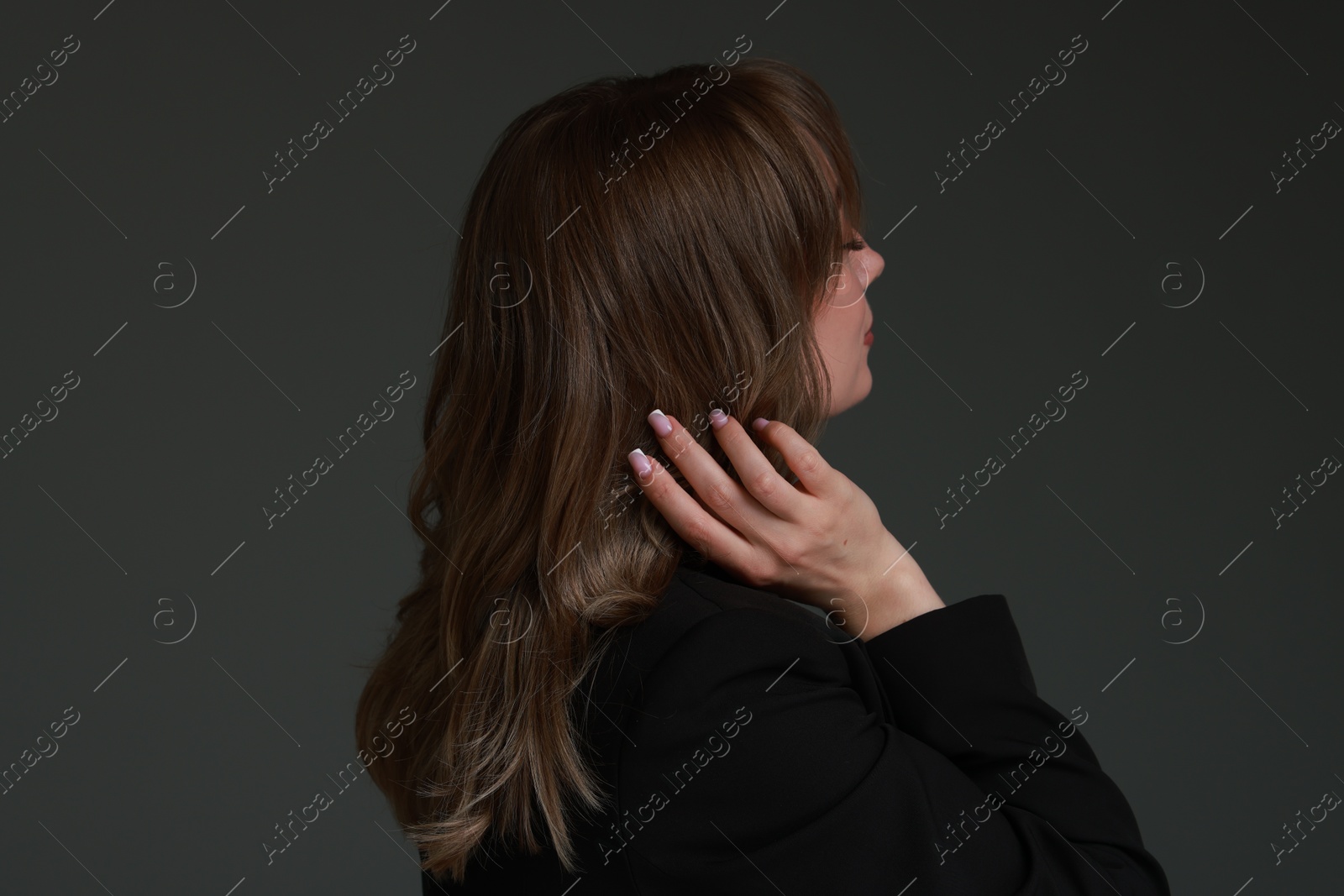 Photo of Attractive woman with stylish haircut on grey background