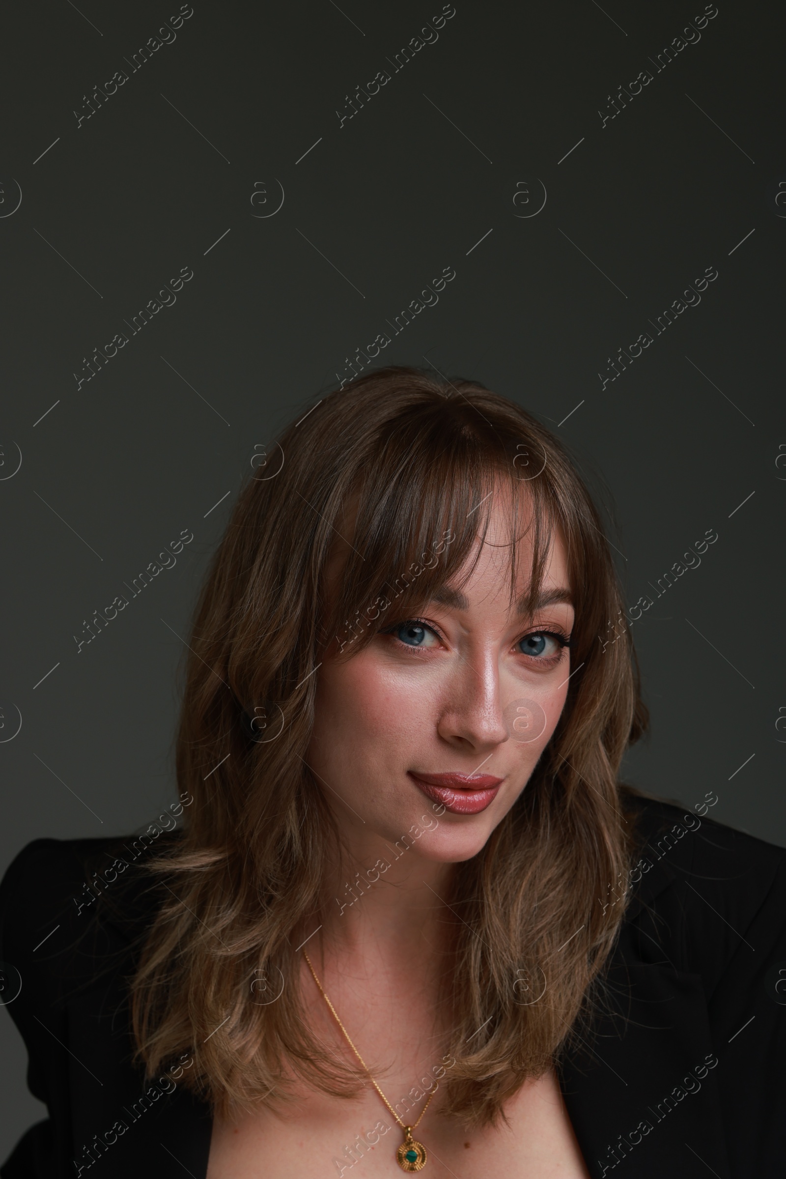 Photo of Attractive woman with stylish haircut on grey background