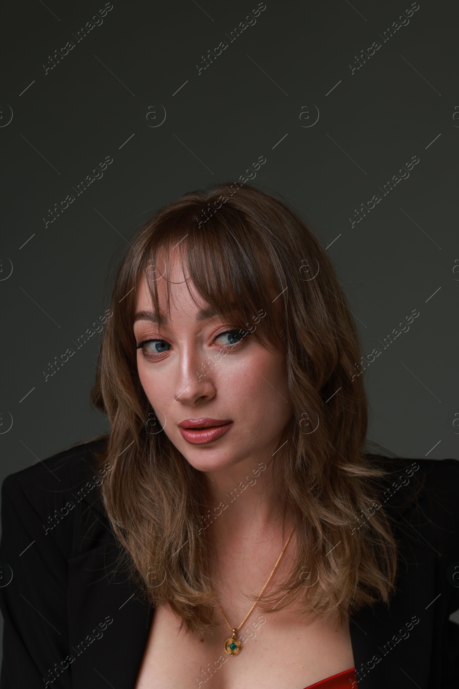 Photo of Attractive woman with stylish haircut on grey background