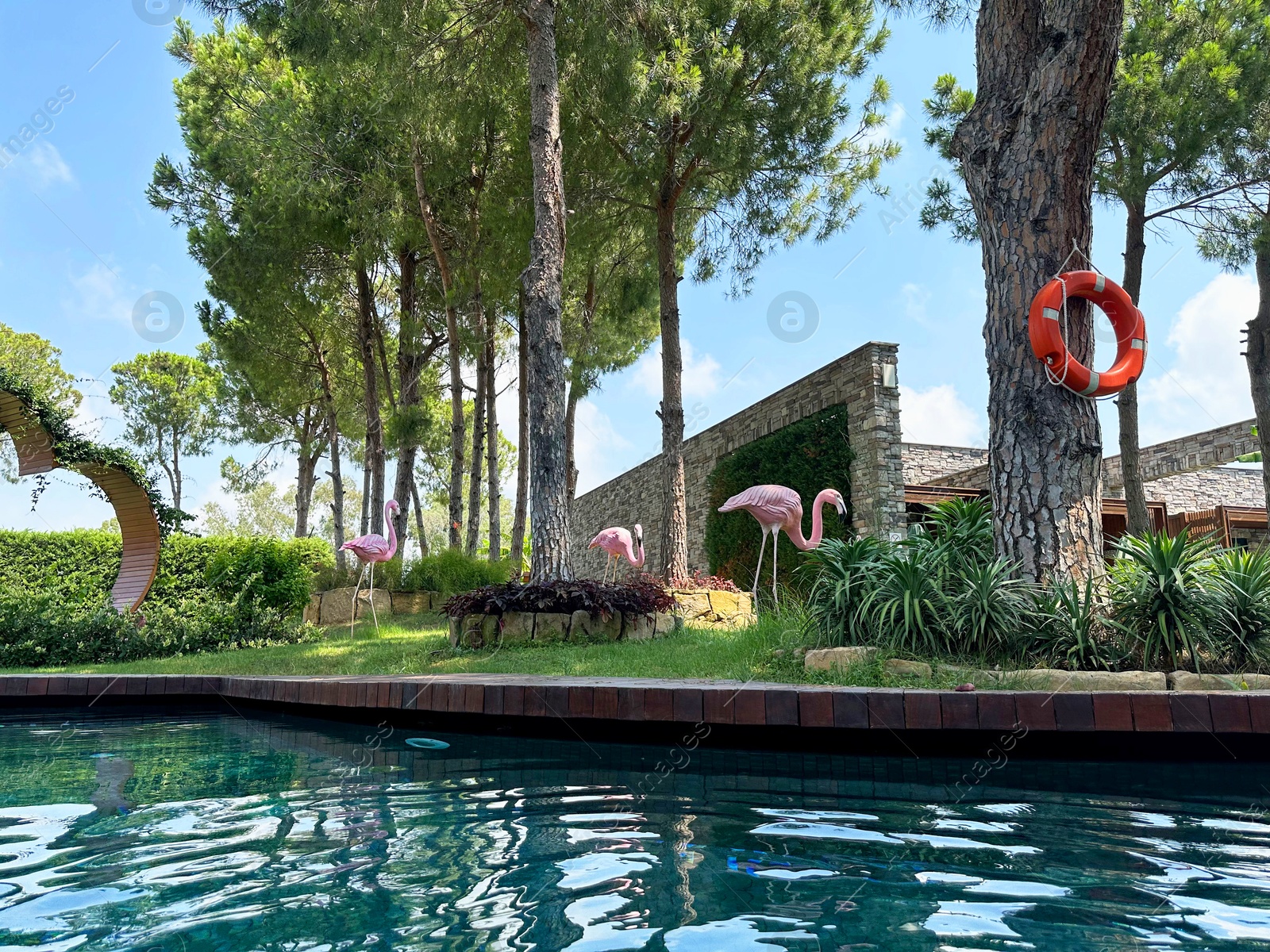 Photo of Outdoor swimming pool with clear water at luxury resort