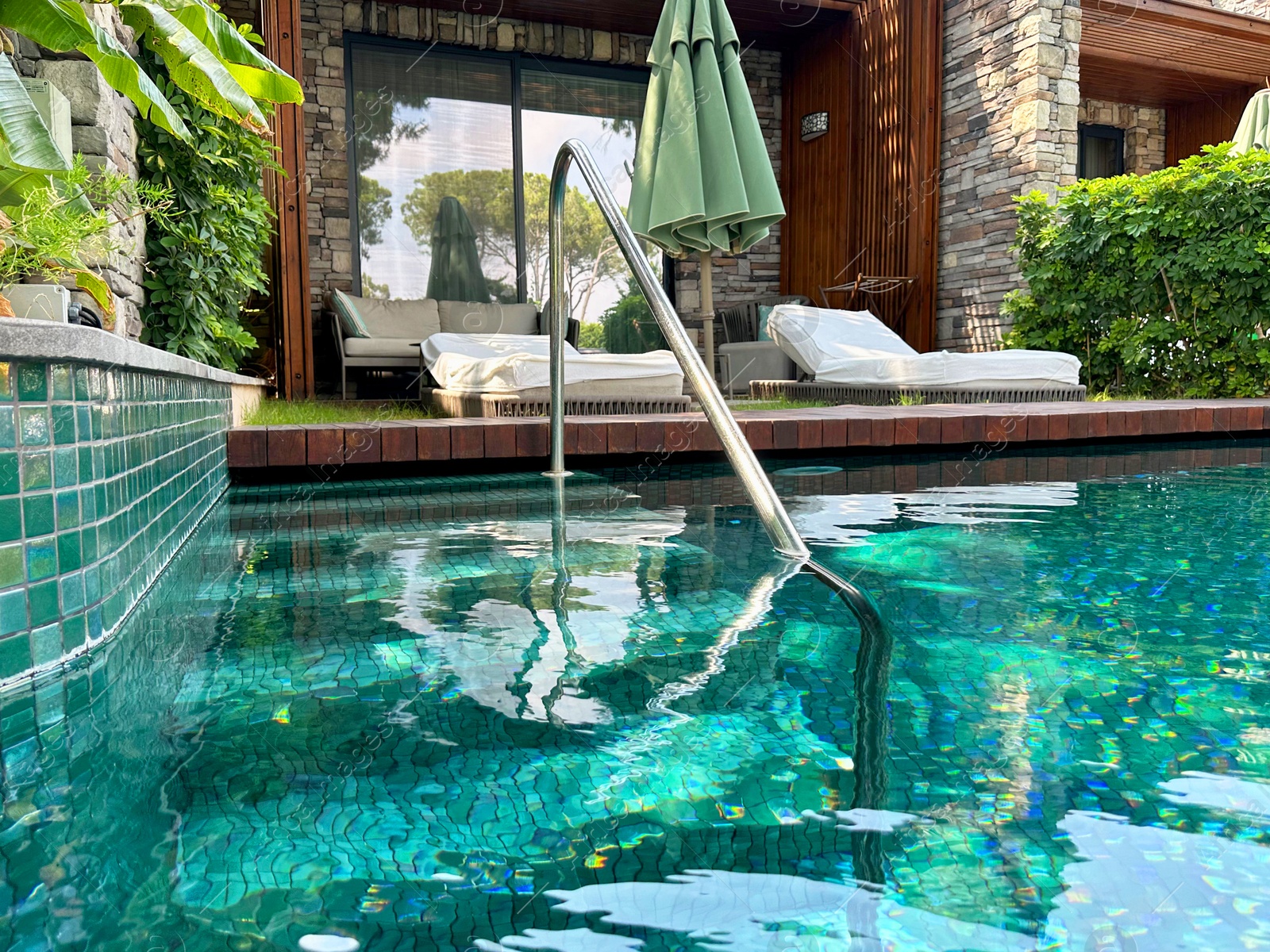 Photo of Outdoor swimming pool with clear water at luxury resort