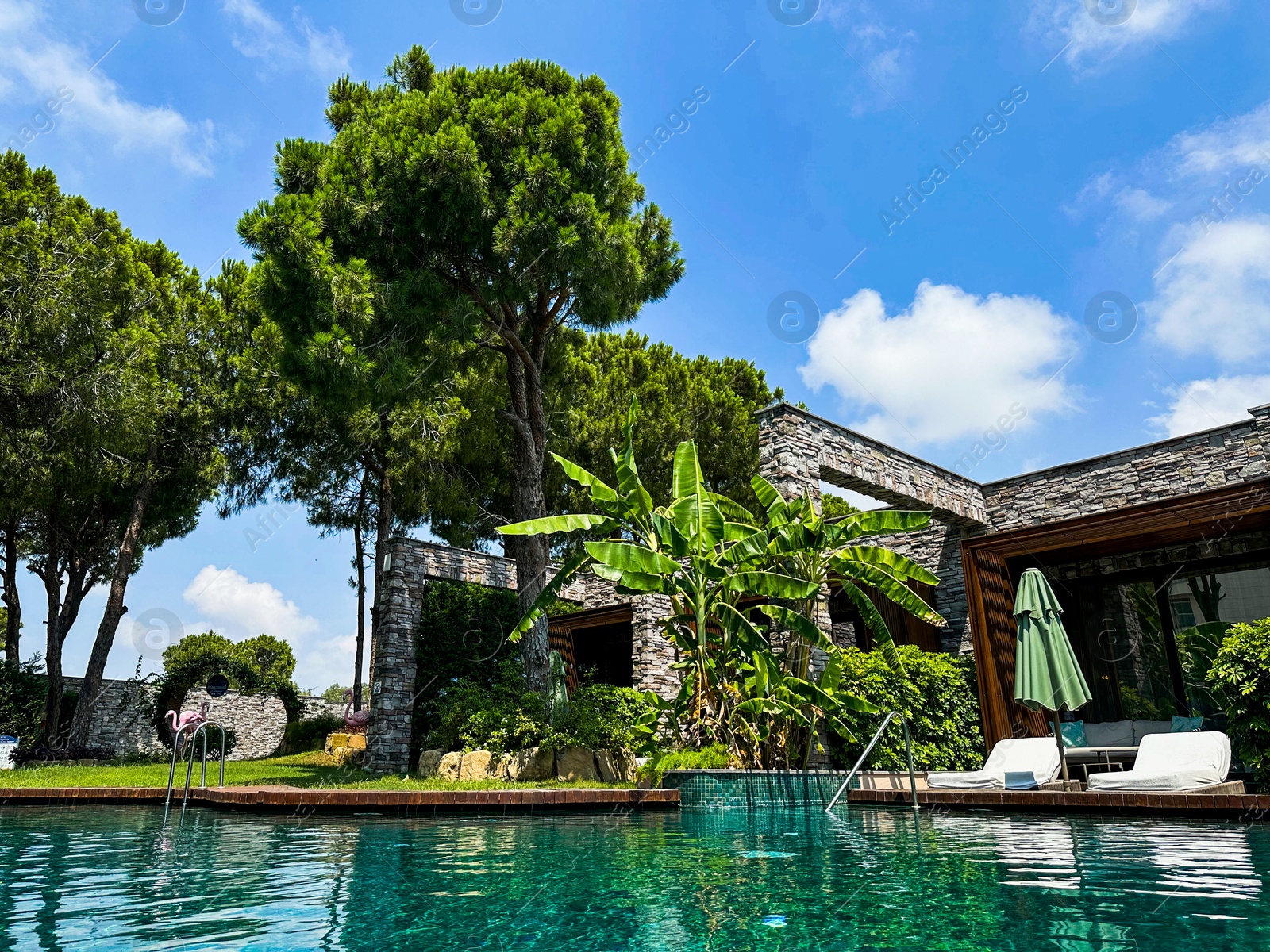 Photo of Outdoor swimming pool with clear water at luxury resort