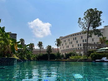 Outdoor swimming pool with clear water at luxury resort