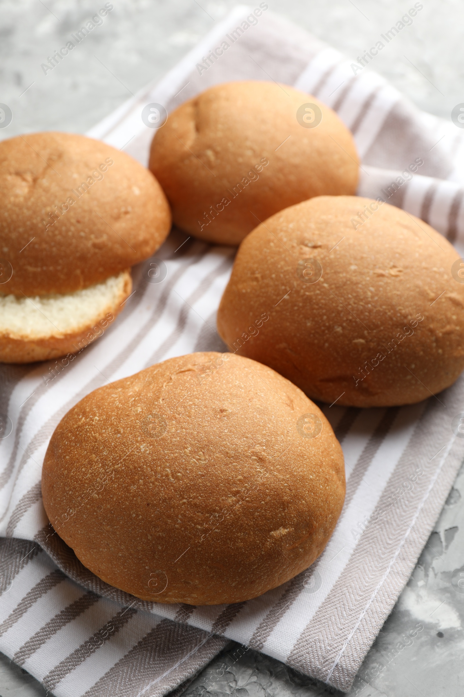 Photo of Many fresh tasty buns on table, closeup