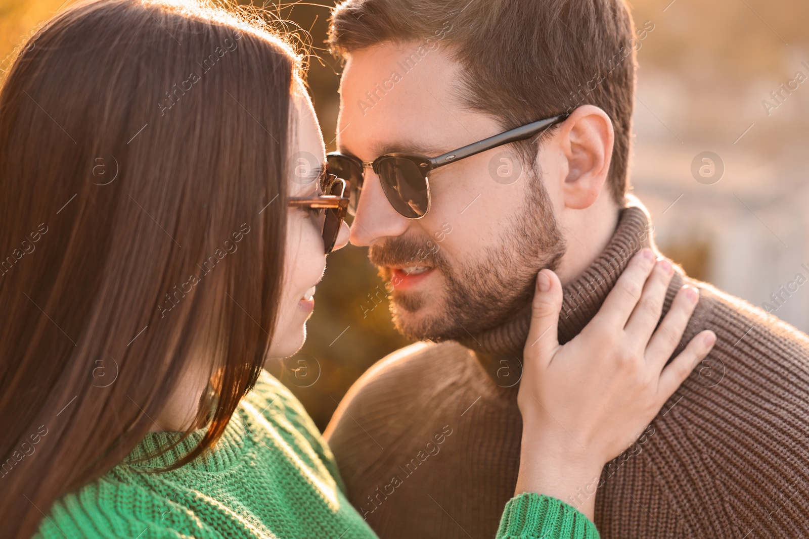 Photo of Beautiful couple enjoying their time together outdoors in autumn evening