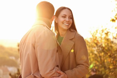 Beautiful couple spending time together in autumn park