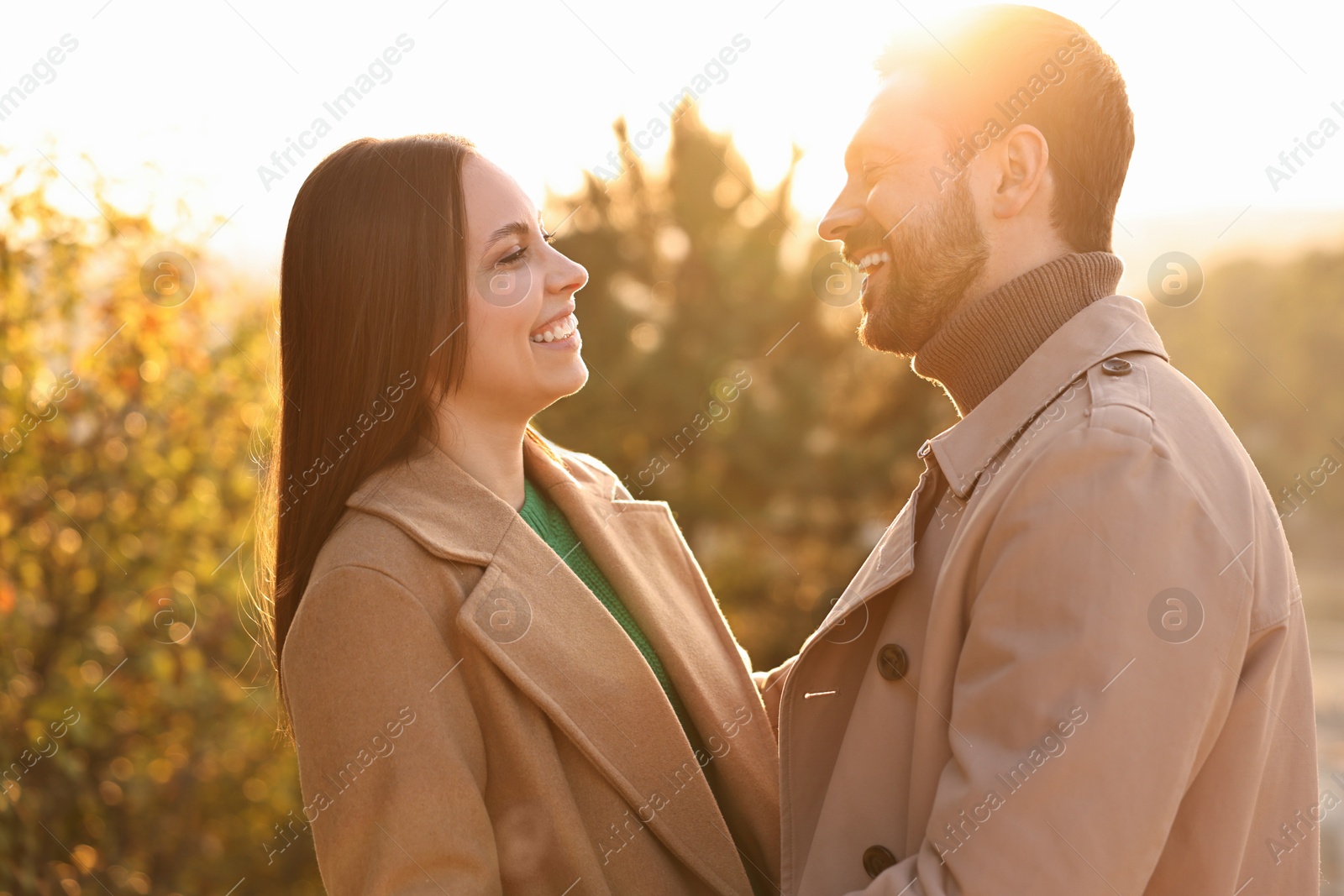 Photo of Beautiful couple spending time together in autumn park