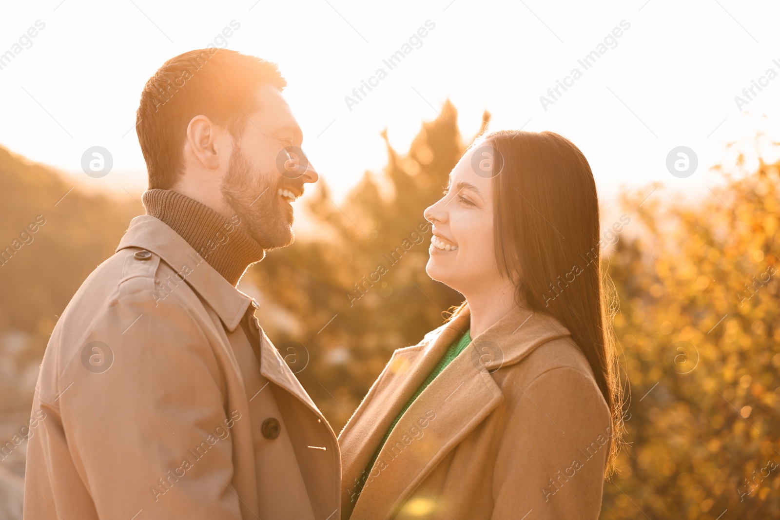 Photo of Beautiful couple spending time together in autumn park