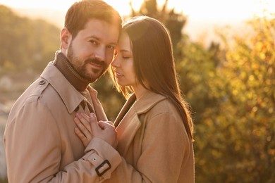 Photo of Beautiful couple enjoying their time together outdoors in autumn evening