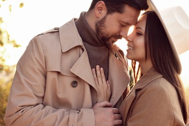 Beautiful couple enjoying their time together outdoors in autumn evening