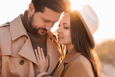 Photo of Beautiful couple enjoying their time together outdoors in autumn evening