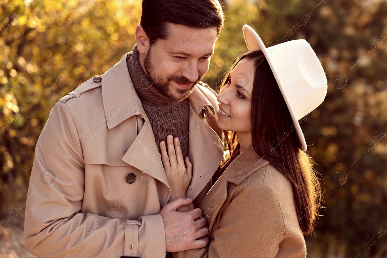 Photo of Beautiful couple spending time together in autumn park