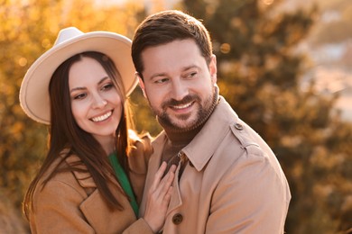 Photo of Beautiful couple spending time together in autumn park