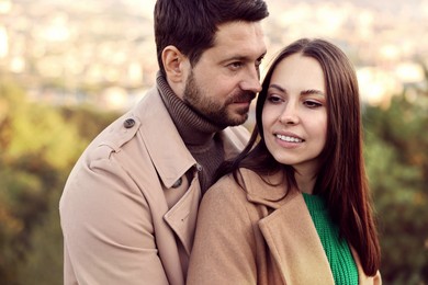 Photo of Beautiful couple spending time together outdoors on autumn day