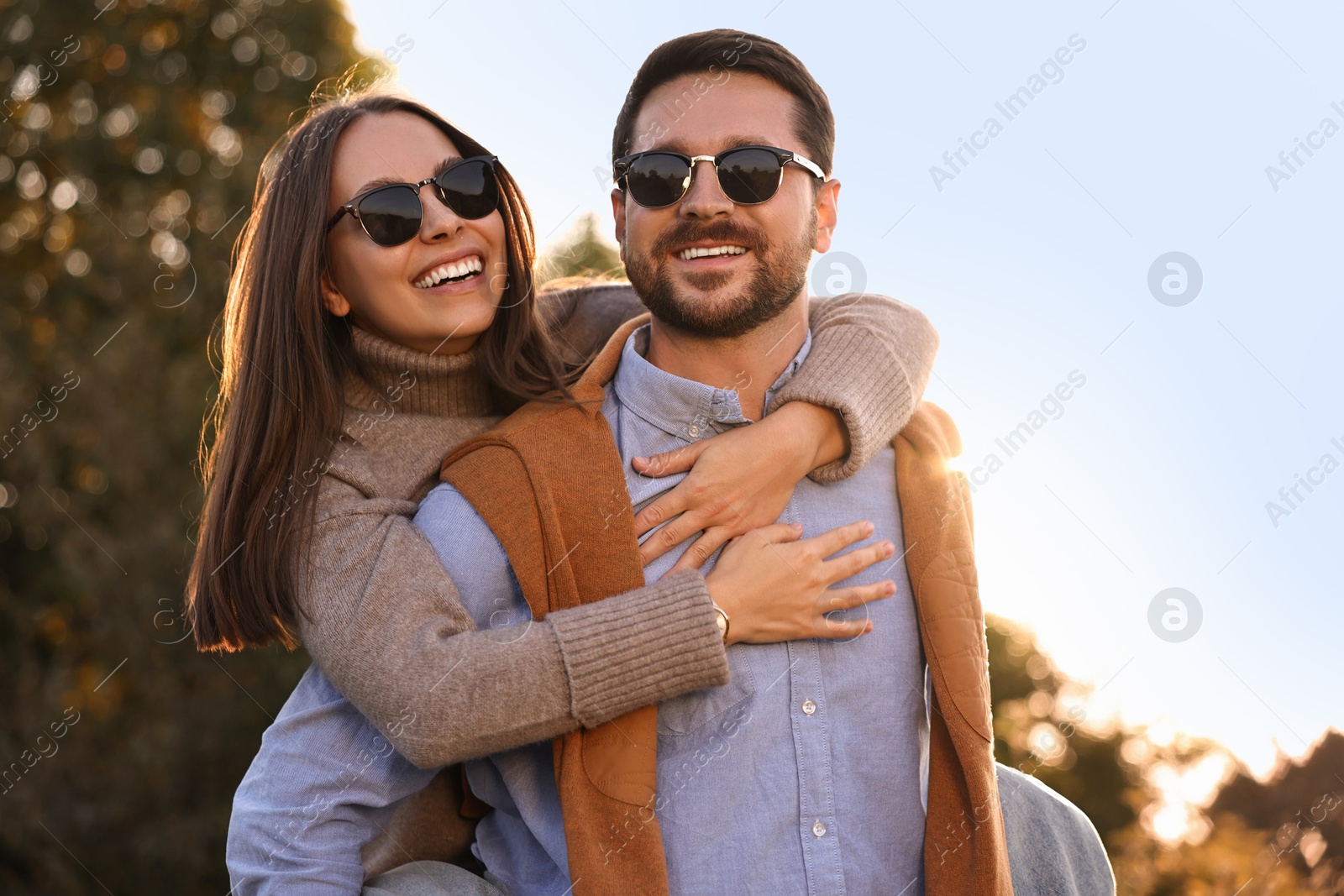 Photo of Beautiful couple having fun together in autumn park