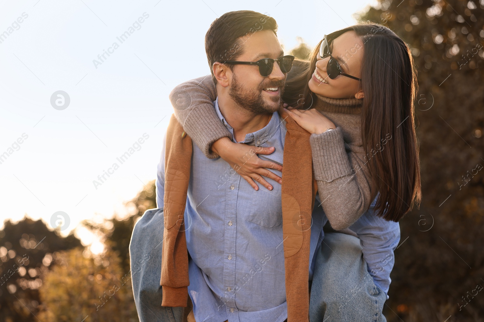 Photo of Beautiful couple having fun together in autumn park