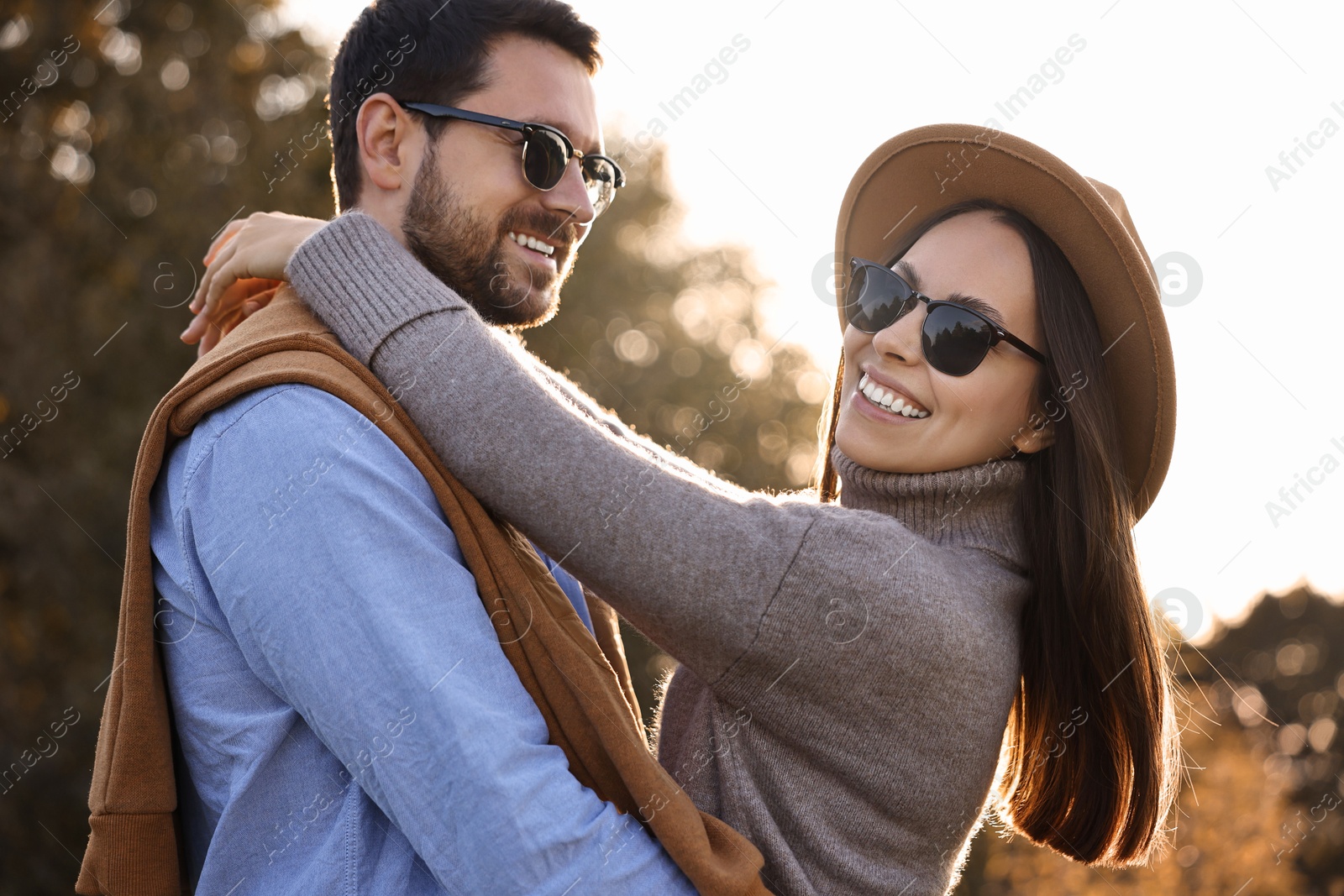 Photo of Beautiful couple spending time together in autumn park