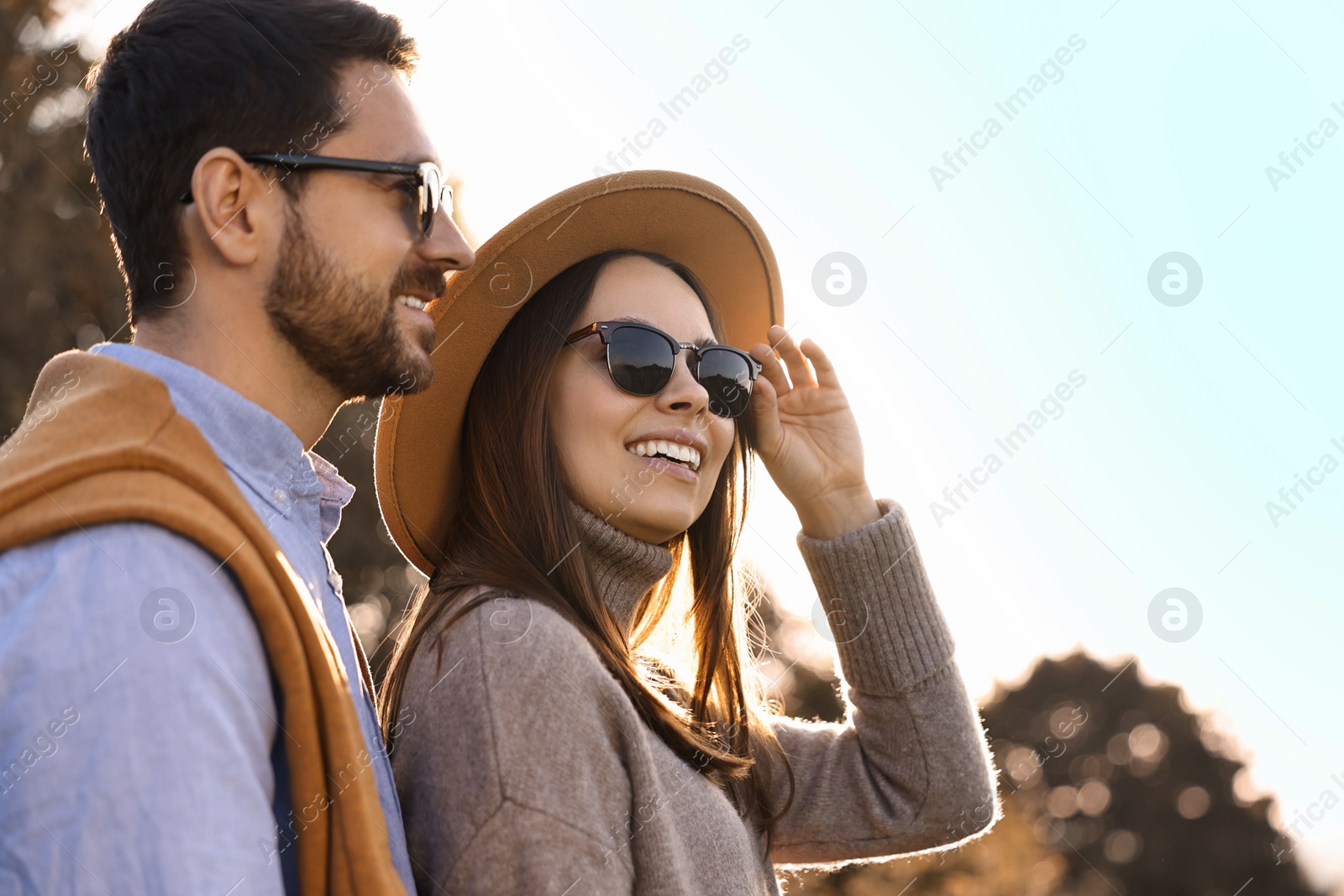 Photo of Beautiful couple spending time together in autumn park