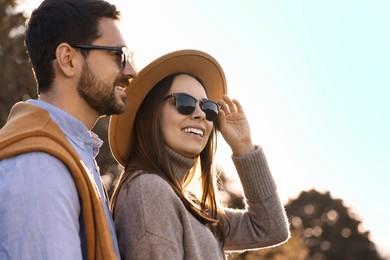 Photo of Beautiful couple spending time together in autumn park