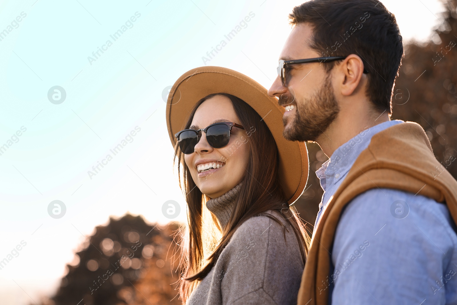 Photo of Beautiful couple spending time together in autumn park