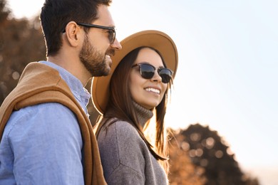 Photo of Beautiful couple spending time together in autumn park