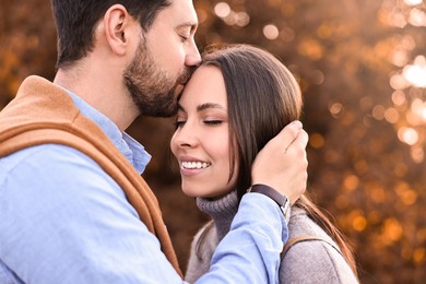 Photo of Beautiful couple spending time together outdoors on autumn day