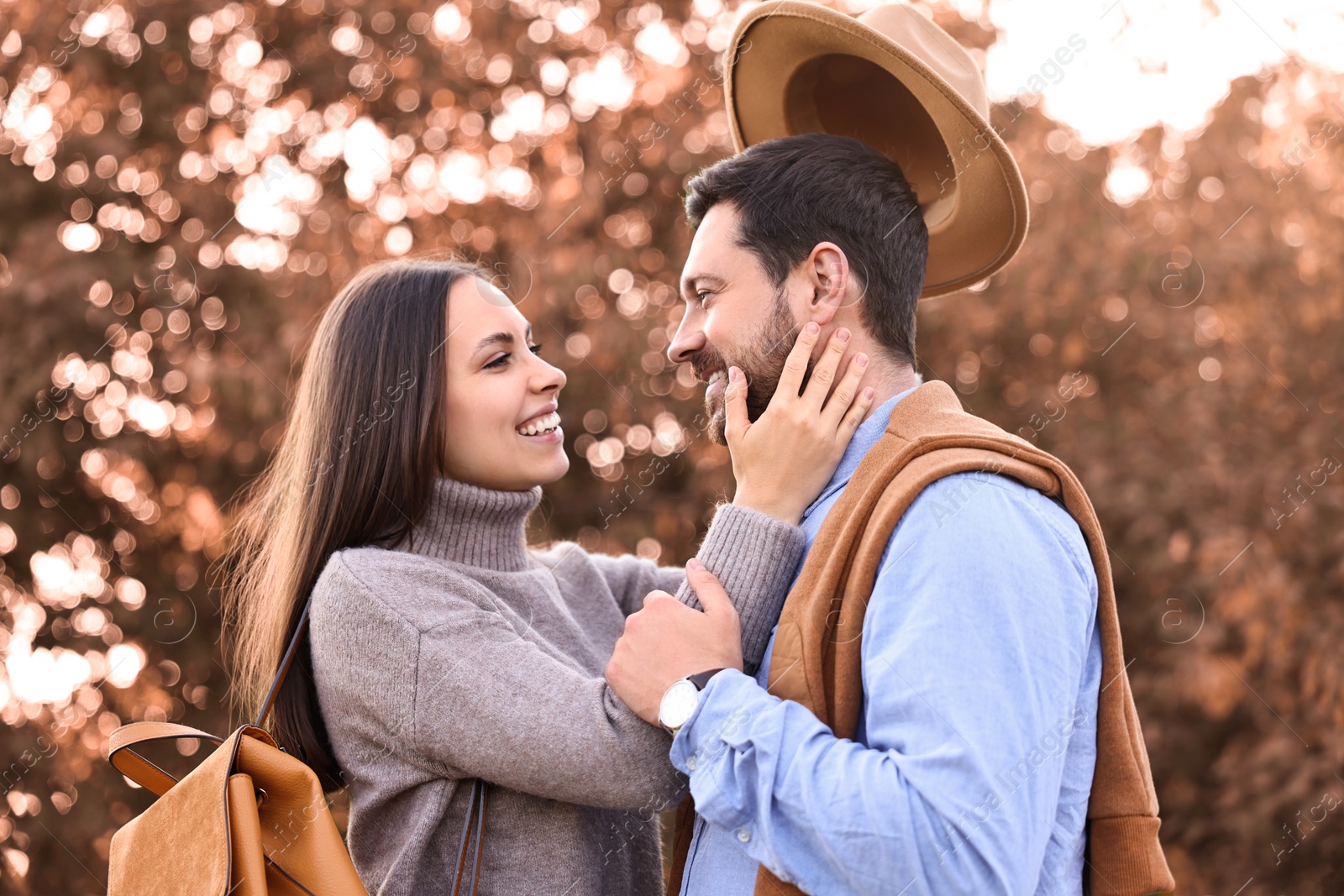 Photo of Beautiful couple spending time together outdoors on autumn day