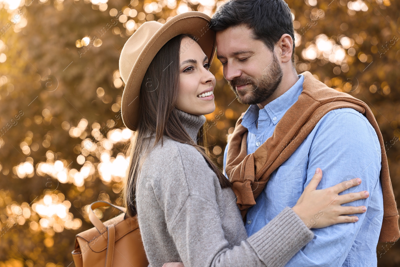 Photo of Beautiful couple spending time together outdoors on autumn day