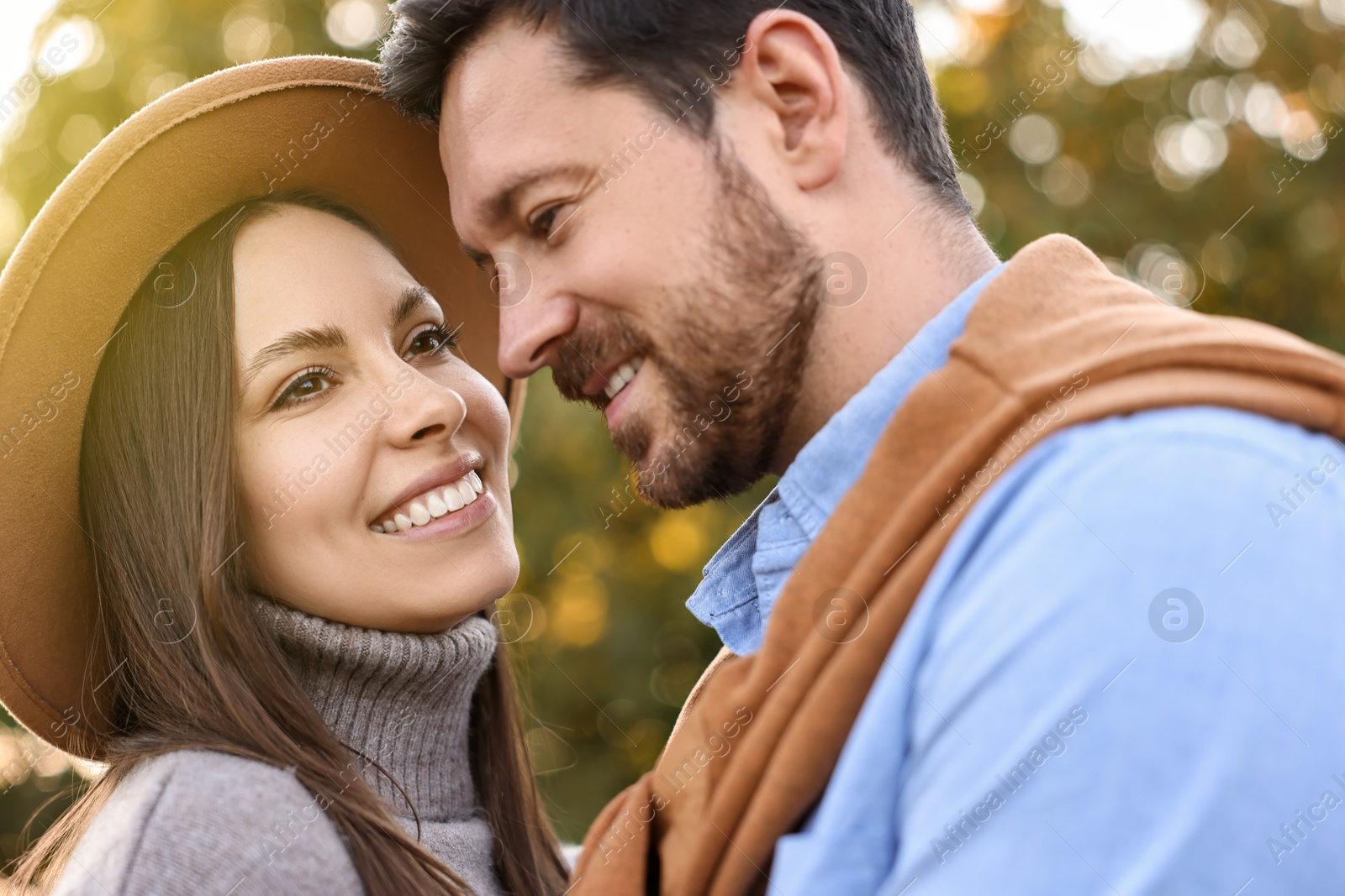 Photo of Beautiful couple spending time together outdoors on autumn day