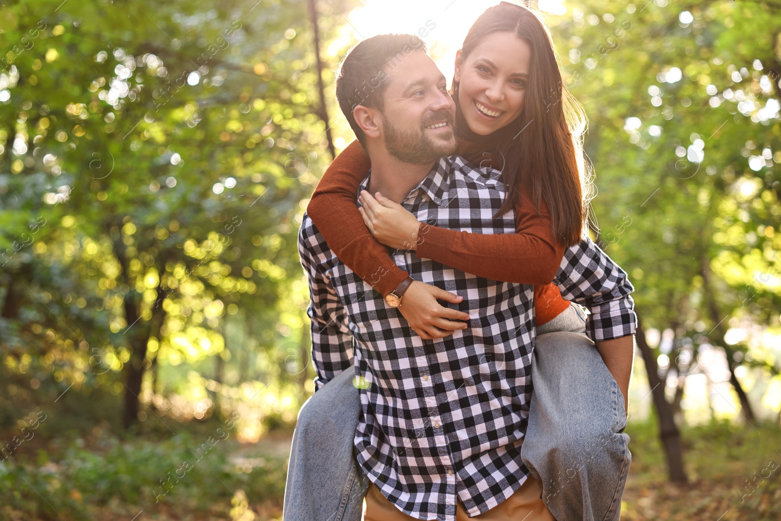 Photo of Beautiful couple having fun together in park on autumn day