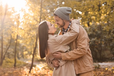 Photo of Beautiful couple spending time in park on autumn day