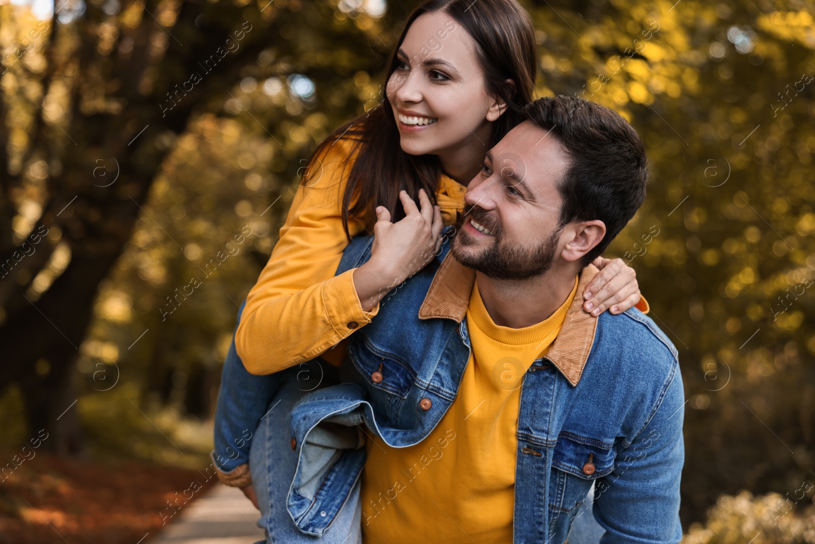 Photo of Beautiful couple spending time together in park on autumn day