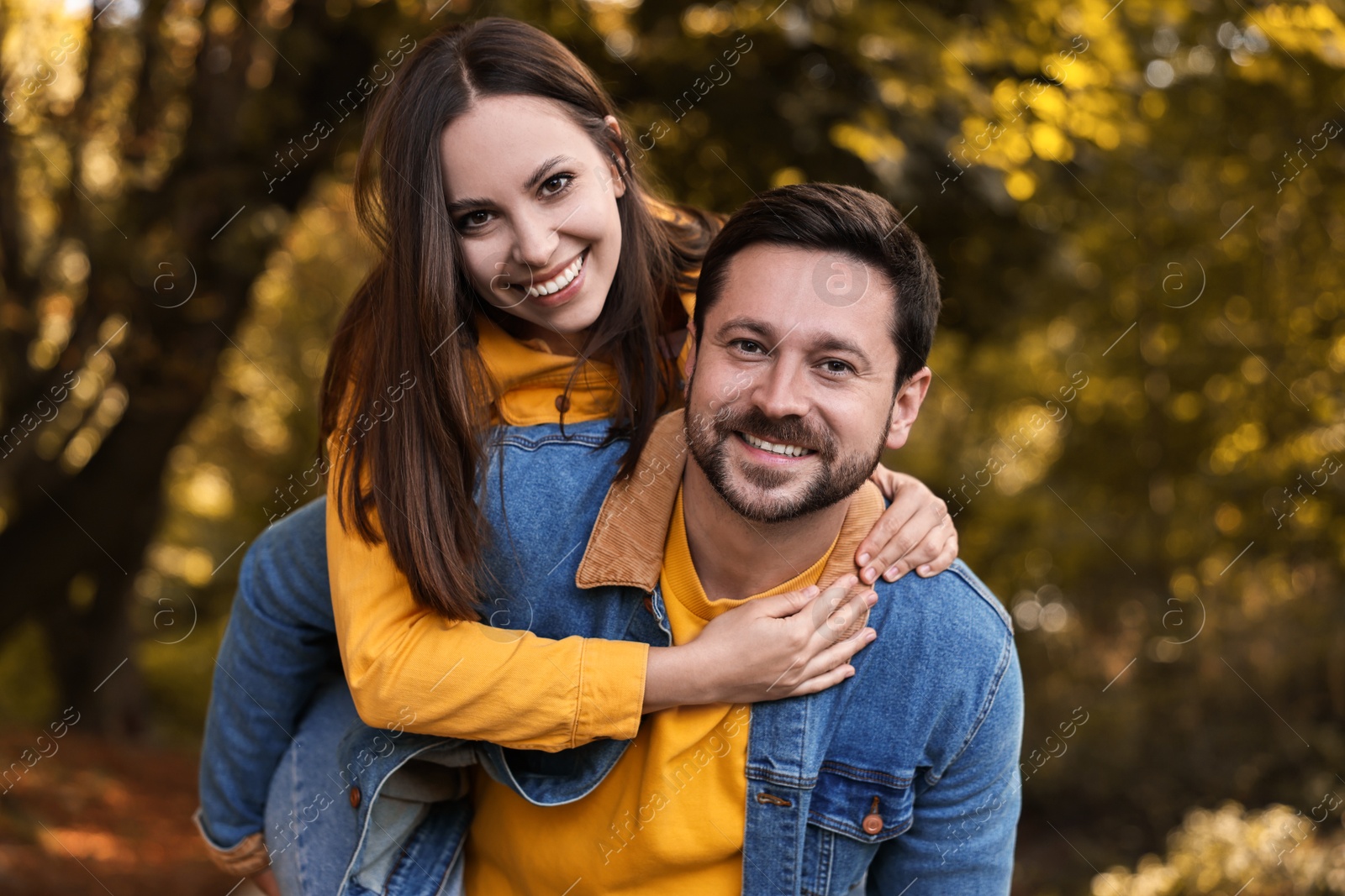 Photo of Portrait of beautiful couple in park on autumn day