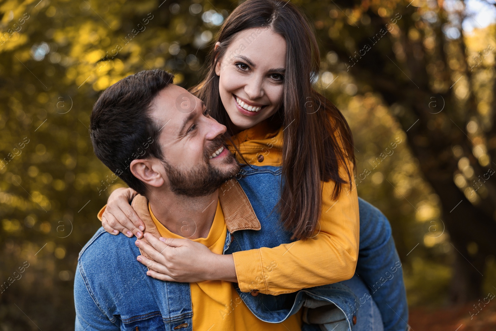 Photo of Beautiful couple spending time together in park on autumn day