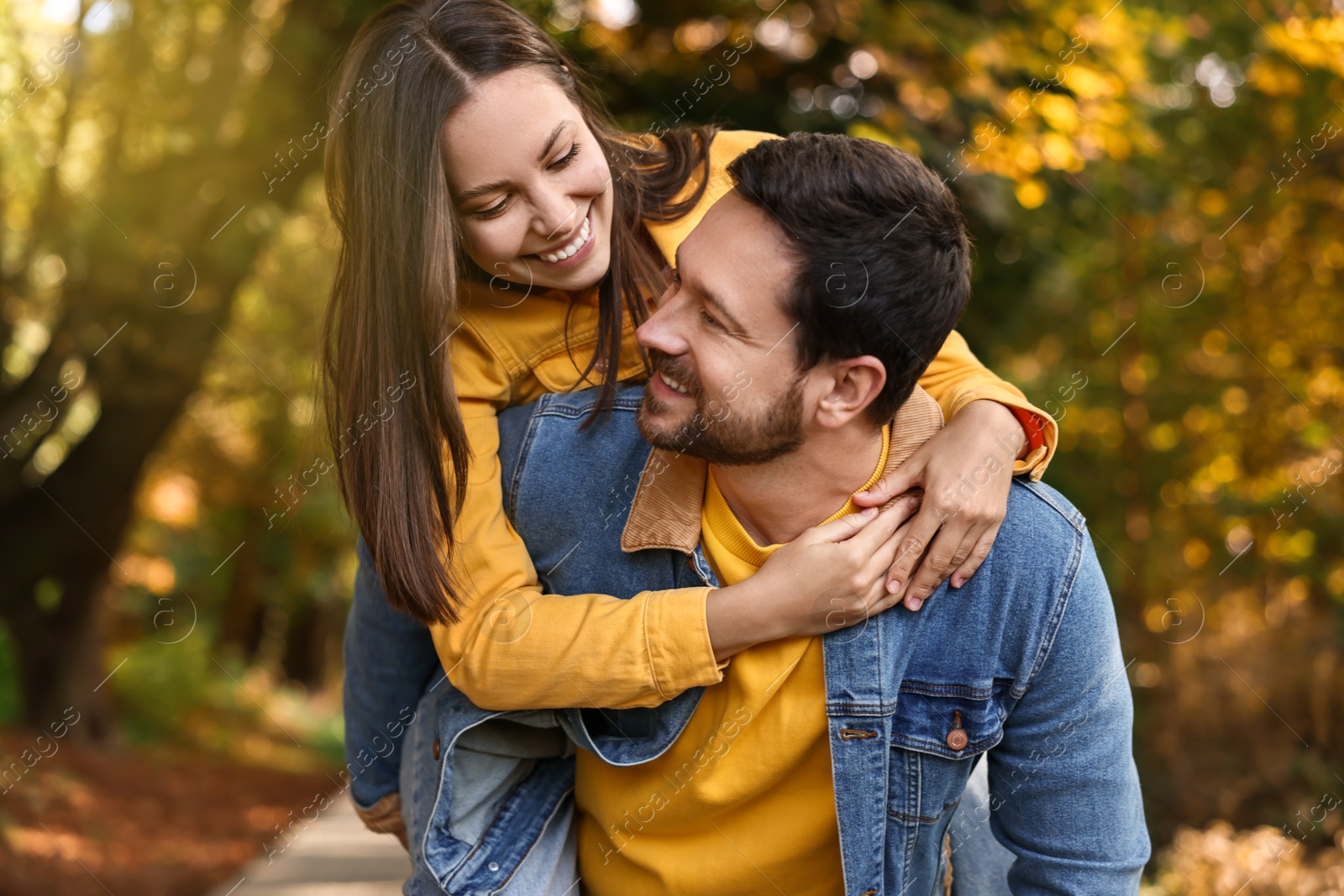 Photo of Beautiful couple spending time together in park on autumn day