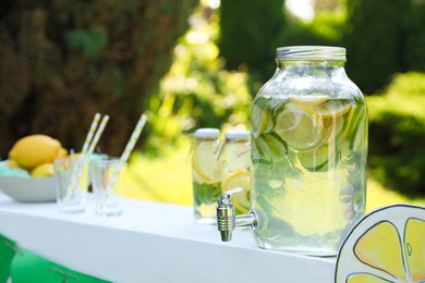 Photo of Lemonade stand with refreshing drink in park