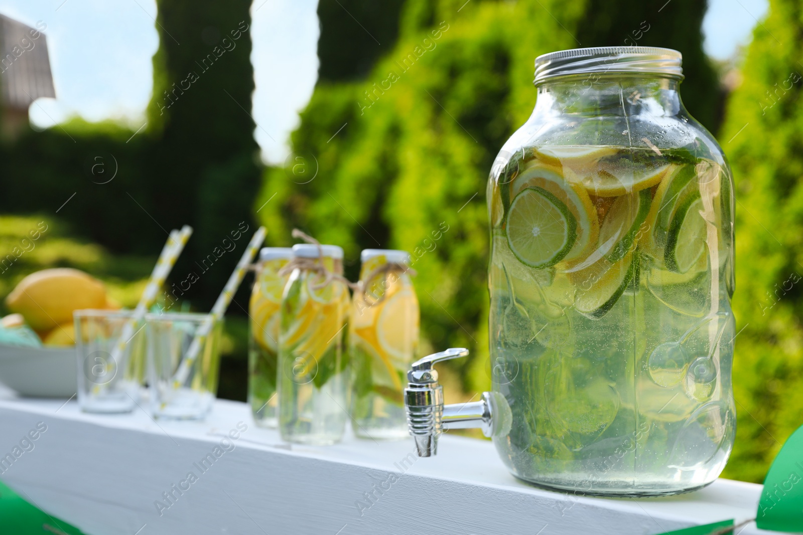 Photo of Lemonade stand with refreshing drink in park