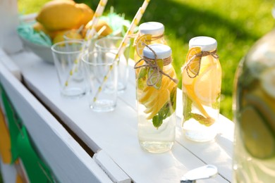 Photo of Lemonade stand with refreshing drink in park