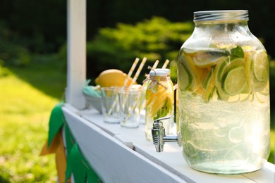 Photo of Lemonade stand with refreshing drink in park