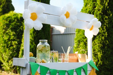 Photo of Lemonade stand with refreshing drink in park