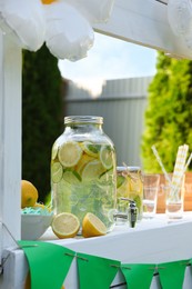 Lemonade stand with refreshing drink in park