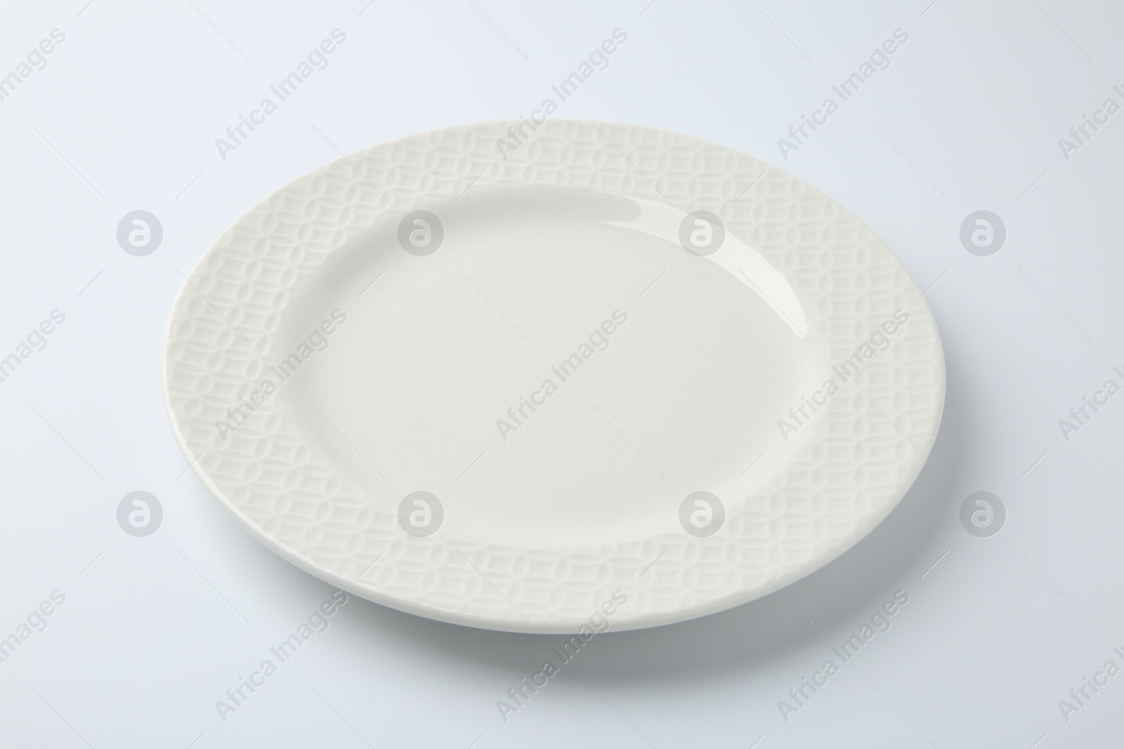 Photo of One empty ceramic plate isolated on white