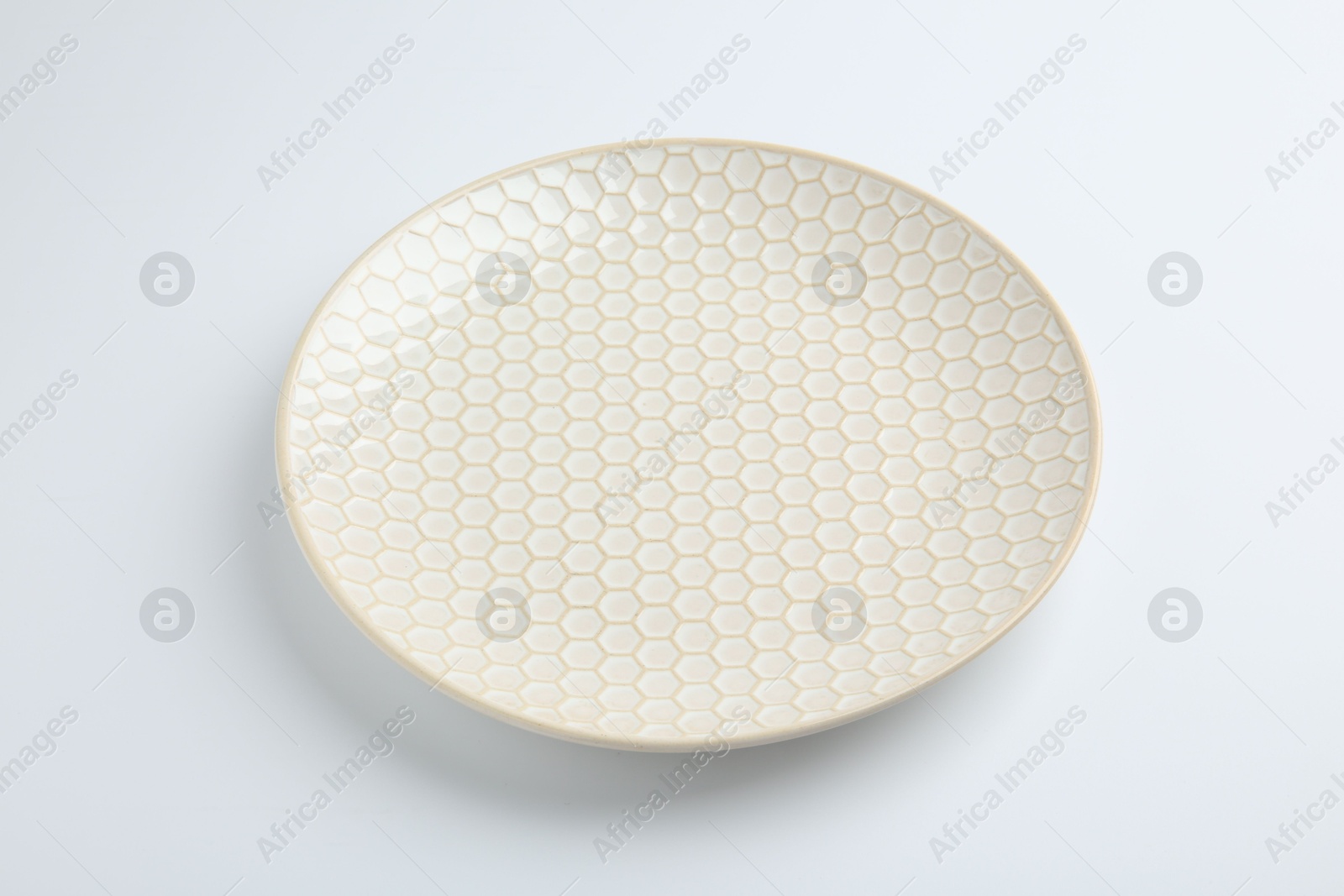 Photo of One empty ceramic plate isolated on white