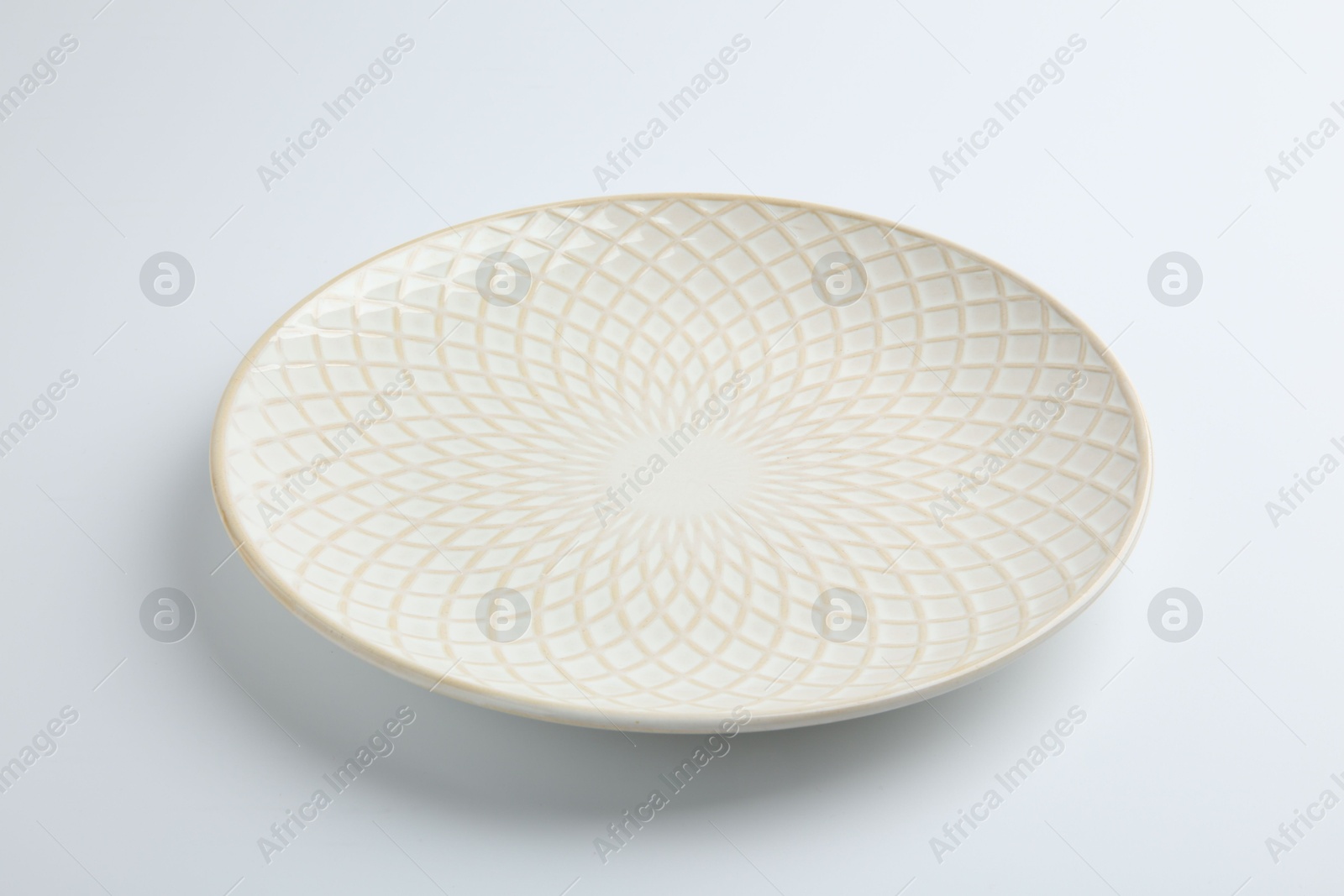 Photo of One empty ceramic plate isolated on white