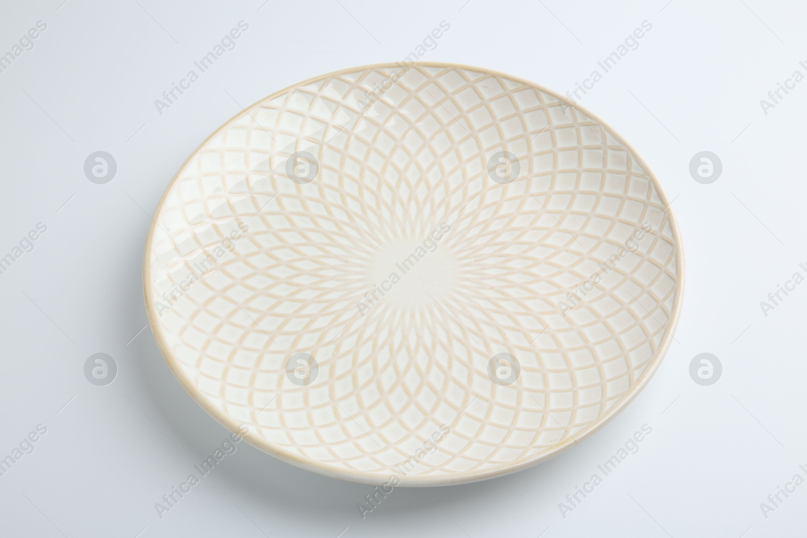 Photo of One empty ceramic plate isolated on white