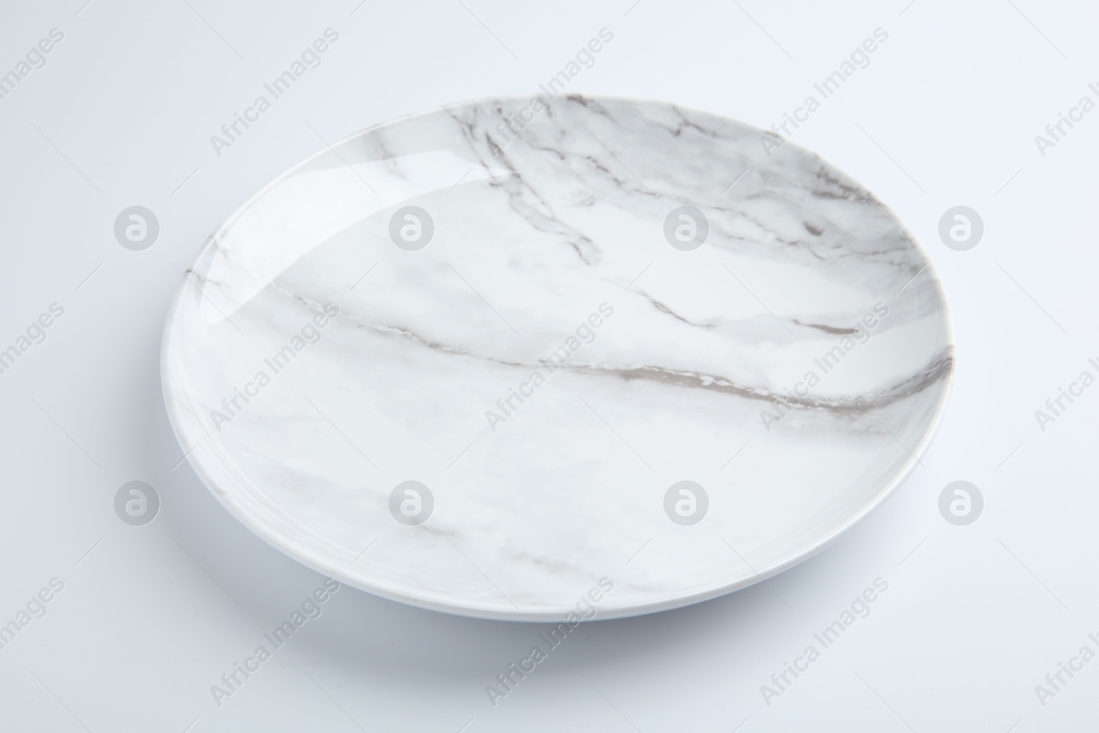 Photo of One empty ceramic plate isolated on white