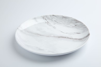 Photo of One empty ceramic plate isolated on white