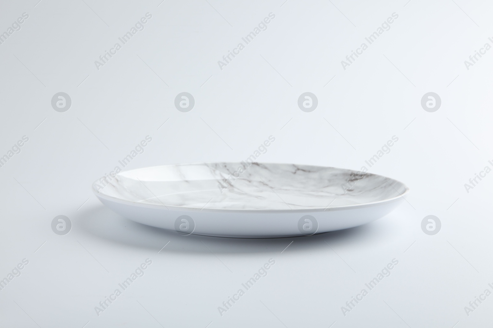 Photo of One empty ceramic plate isolated on white