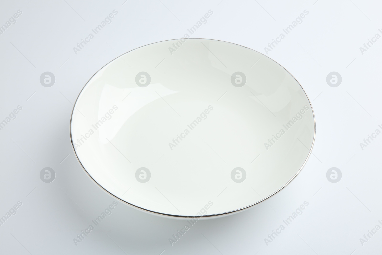 Photo of One empty ceramic bowl isolated on white